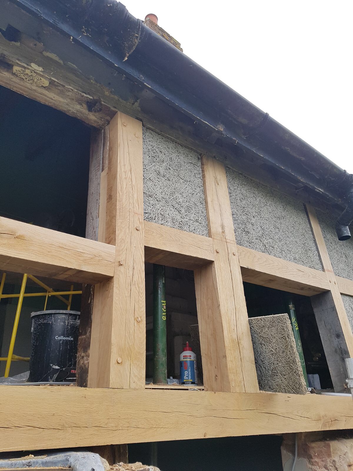 Decayed and collapsing wall frame rebuilt with new lime rendered panels